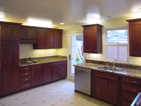 Kitchen - Features under-cabinet and cove lighting, secondary sink, pantry.