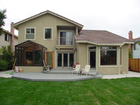 Exterior, Rear - Nook (left), living room (right), dining room (center) all open to rear deck.